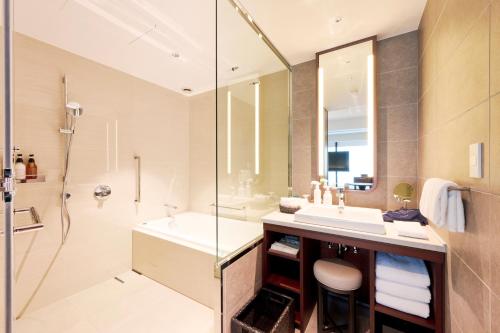 a bathroom with a sink and a shower at Marunouchi Hotel in Tokyo