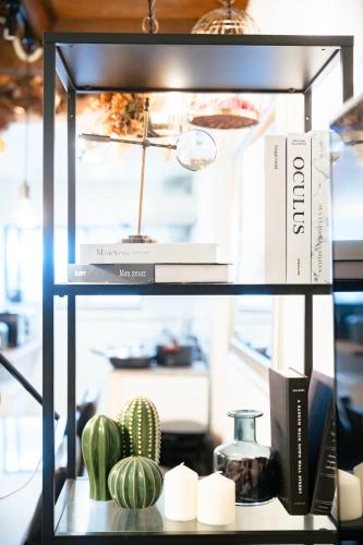 a shelf with a cactus and a box on it at SAKURA House in Nagoya