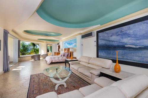 a living room with a couch and a large tv at P V near Colomitos Beach Boutique Hotel in Puerto Vallarta