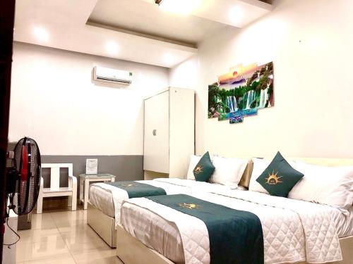 a bedroom with two beds in a room at Holiday Hotel 2 in Hai Phong