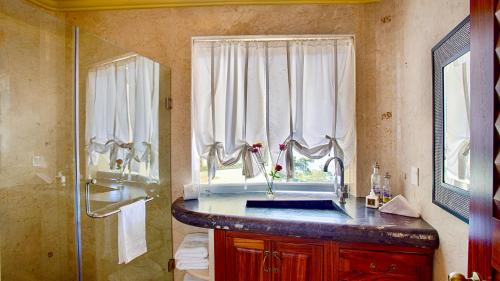 a bathroom with a sink and a shower at P V near Colomitos Beach Boutique Hotel in Puerto Vallarta