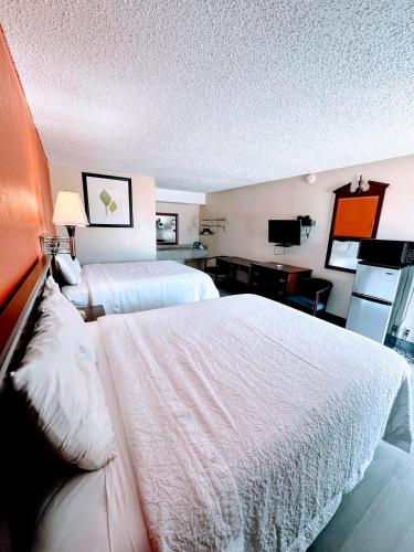 Ένα ή περισσότερα κρεβάτια σε δωμάτιο στο Relax Inn Henryetta