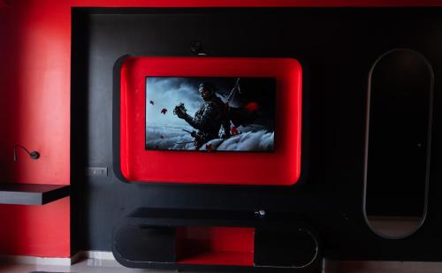 a tv with a picture of a soldier on it at Omaxe Hazratganj- Healing Staytion- Lucknow in Lucknow