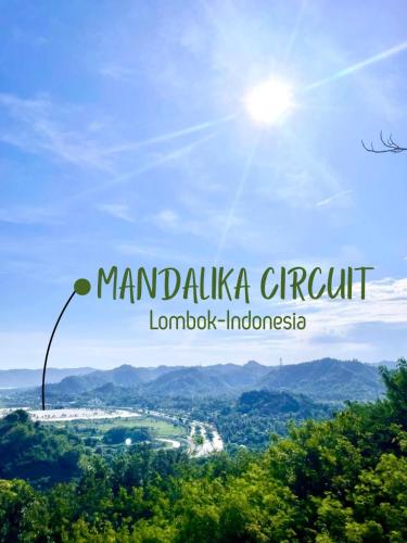 a view of the mountains with a street light in the foreground at Truntum Boutique Mandalika in Kuta Lombok