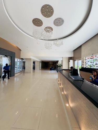 a lobby of a building with a long hallway at Sea Residences Mall of Asia Viann in Manila