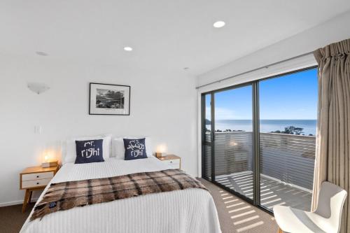 Ένα ή περισσότερα κρεβάτια σε δωμάτιο στο Kaiteriteri Luxury Apartment