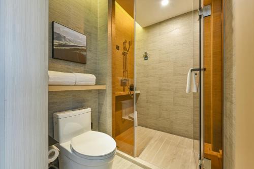 a bathroom with a toilet and a shower at Atour Hotel Shanghai Songjiang Sports Center in Shanghai