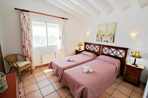 A bed or beds in a room at Marcelo - charming, Finca style holiday villa in Moraira