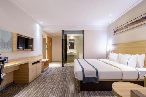 Letto o letti in una camera di City Comfort Inn Nanning Railway Station