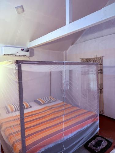 Ένα ή περισσότερα κρεβάτια σε δωμάτιο στο Green Surf Cabana