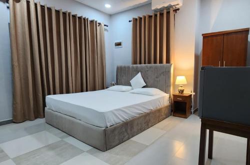 Una cama o camas en una habitación de Fairfield Villa Colombo