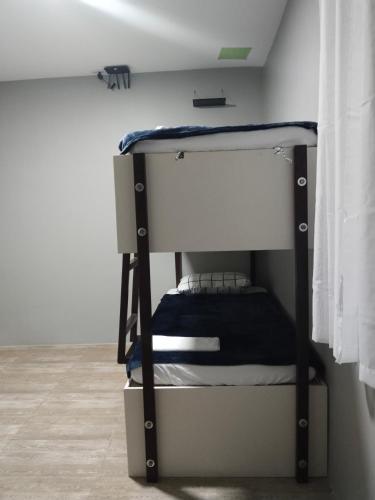 a bunk bed in the corner of a room at YES Guesthouse in Angeles