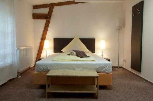 Postel nebo postele na pokoji v ubytování Perle Hotel