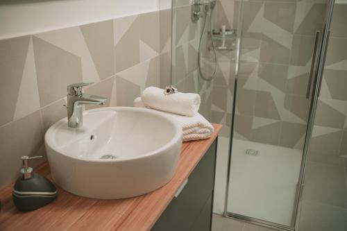 a bathroom with a sink and a shower at Texlhof - Stella Alpina in Parcines