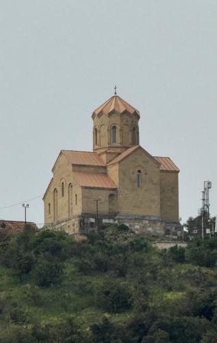 an old church sitting on top of a hill at Boutique Hotel Tiflis in Tbilisi City