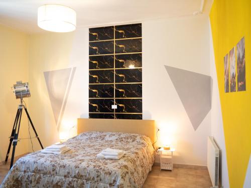 a bedroom with a bed with a wall of mirrors at Affittacamere DaME in Foligno