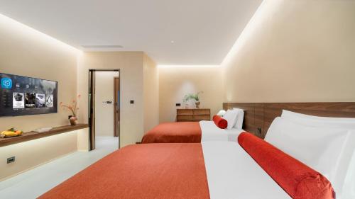 Letto o letti in una camera di Terra Art Garden Hotel