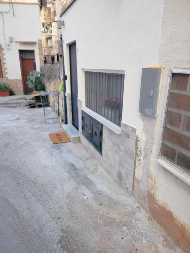 a building with a window on the side of a street at Casa mattya in Palermo