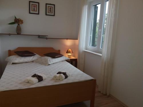 Ένα ή περισσότερα κρεβάτια σε δωμάτιο στο Apartments Franka