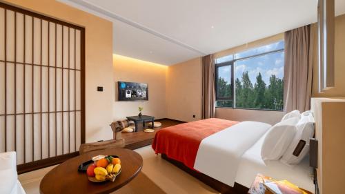 Letto o letti in una camera di Terra Art Garden Hotel