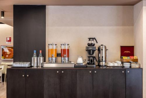 Kuchyň nebo kuchyňský kout v ubytování Stadio Hotel