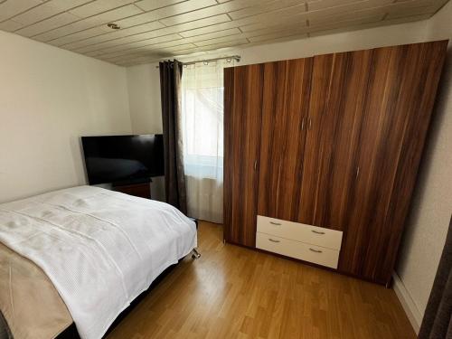 Ένα ή περισσότερα κρεβάτια σε δωμάτιο στο 3 Zimmer Wohnung