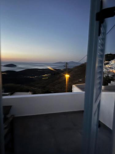 a view of the ocean at night from a balcony at Houses of chora in Serifos Chora