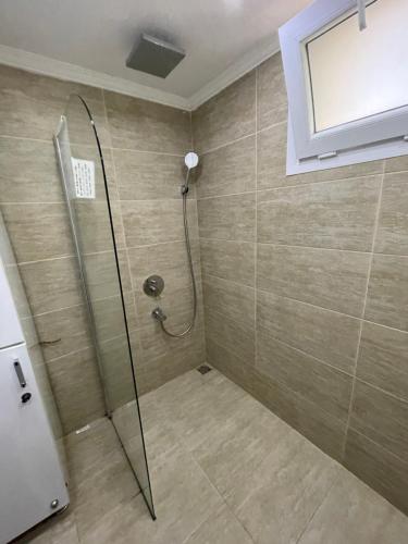 a shower with a glass door in a bathroom at Villa Olive Garden, Kalkan ClubPatara in Kalkan