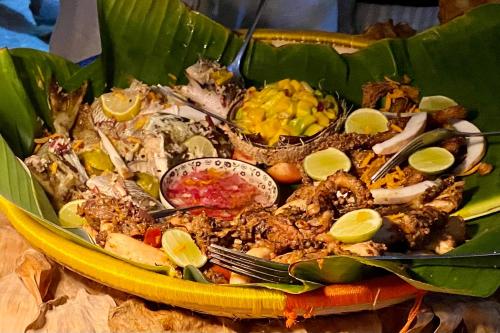 a plate of food in a yellow bowl at Darwesh Nyumba Lodge in Nungwi