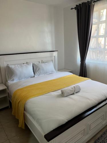 Ένα ή περισσότερα κρεβάτια σε δωμάτιο στο Royal apartments Eldoret