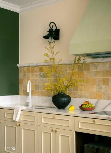 a kitchen with a sink and a bowl of fruit on the counter at Leng - Duplex Onsen Swanlake Ecopark in Kim Quan