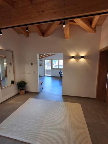 a living room with a rug on the floor at Appartement Glücksschmiede im Zillertal in Stumm