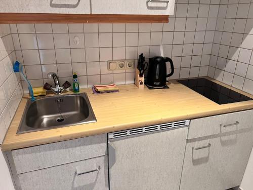 a kitchen counter top with a sink and a sink at Zum Zunterer in Ehrwald