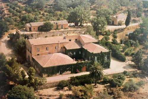 an aerial view of a house with a palm tree at Villa Pietralunga Suite in Nicosia
