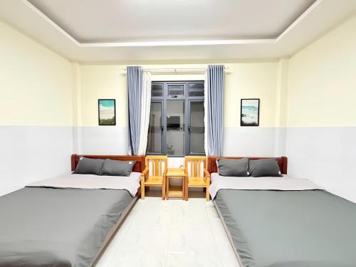 Кровать или кровати в номере De Luna House Dalat - Homestay giá rẻ