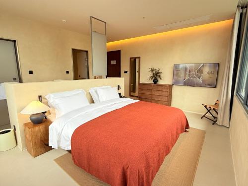 Letto o letti in una camera di Terra Art Garden Hotel