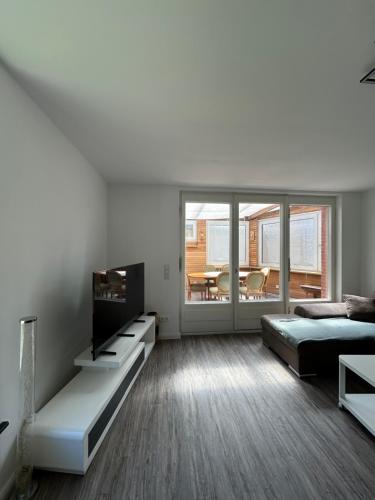 a bedroom with a bed and a television in it at Ferienwohnung am Uniklinik Lübeck in Lübeck