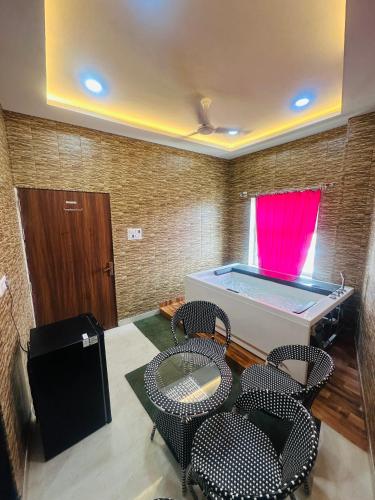 a room with a ping pong table and chairs at hotel deep palace in Varanasi