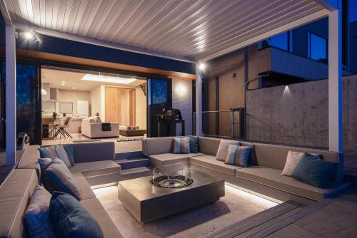 a living room with a couch and a table at Gold Valley Villa C in Futtsu