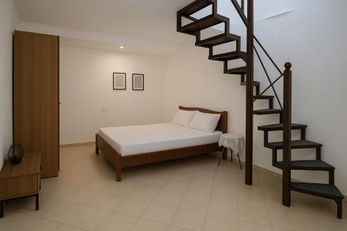 Ένα ή περισσότερα κρεβάτια σε δωμάτιο στο Galiakis rooms