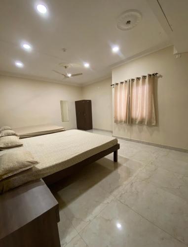 a bedroom with a large bed in a room at The Eklavya Resort in Rānchī