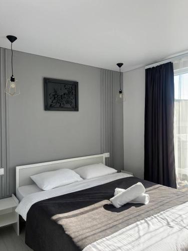 a bedroom with a large bed with two white pillows at Edelweiss New 2026 Солотвино in Solotvyno