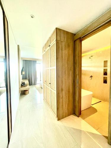 a bathroom with a tub and a sink in a room at Truntum Boutique Mandalika in Kuta Lombok