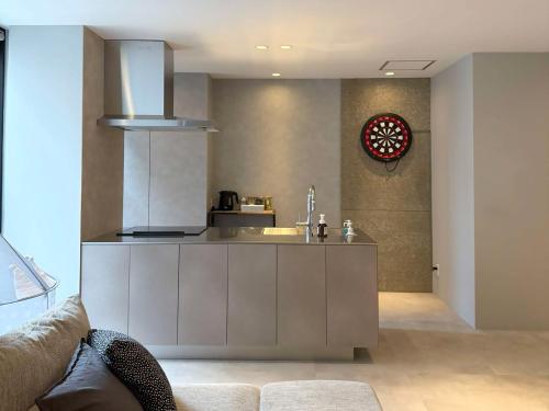 a kitchen with a sink and a counter top at TABISAI HOTEL Terrace 博多 in Fukuoka