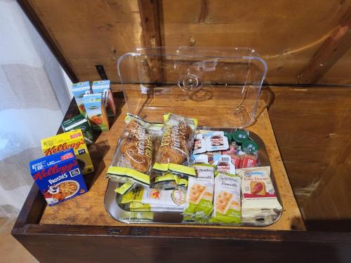 a drawer with a tray of food in a refrigerator at Fonte del Borgo - Tuscan Vein in San Quirico dʼOrcia