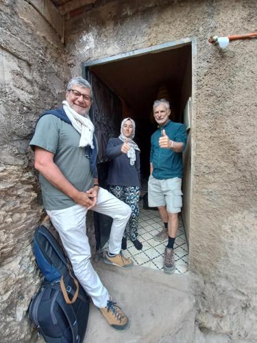 a group of three people standing in a doorway at Atlas Pearl in Aguersioual