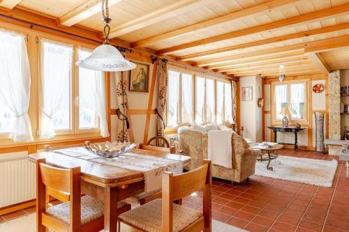 a dining room with a table and chairs at Sunny Mountain in Reckingen - Gluringen