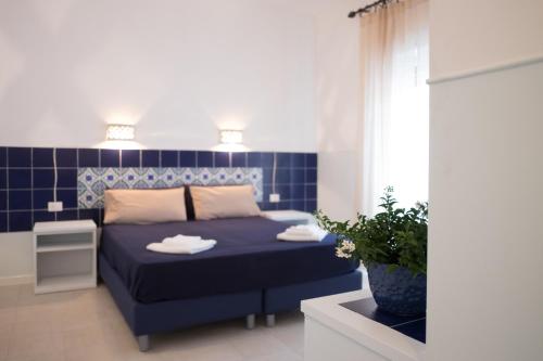Residenza Punta Stendardoにあるベッド