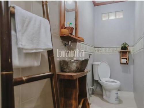 a bathroom with a sink and a toilet at Branta Home Homestay Yogyakarta in Timuran