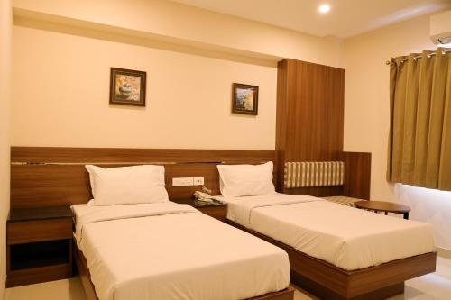 Postel nebo postele na pokoji v ubytování Hotel Le Palace